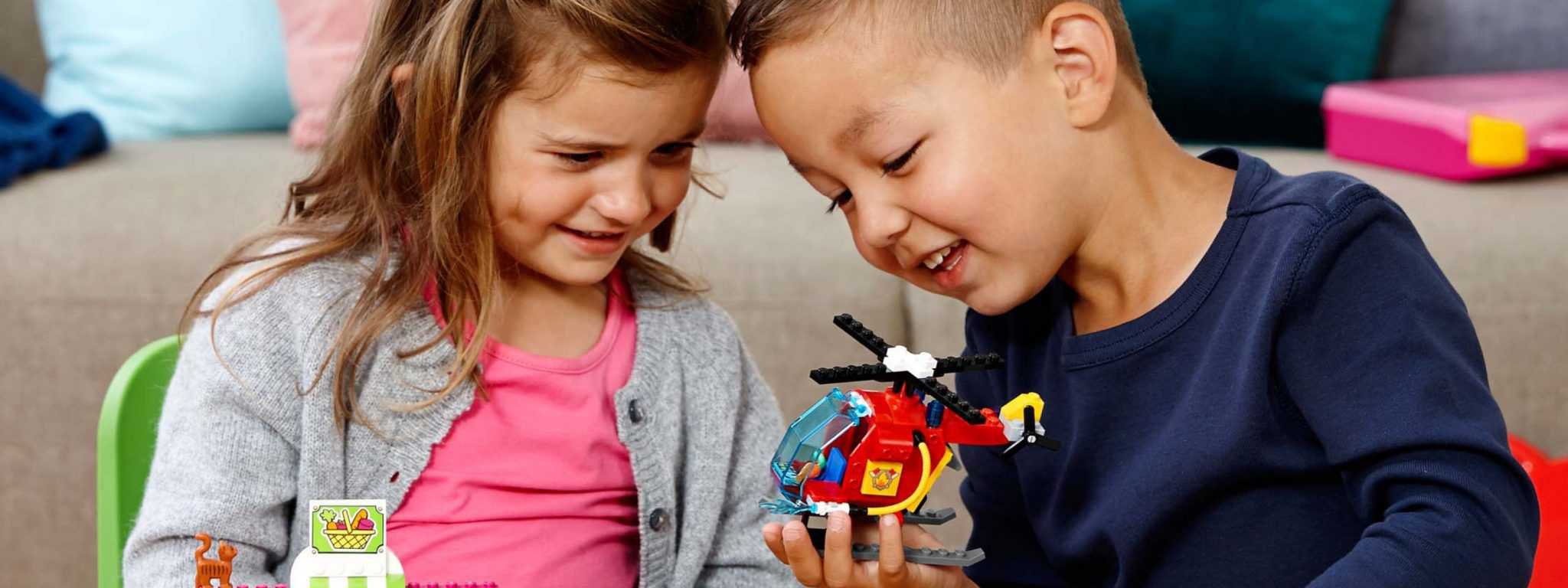 Kids playing with a Lego helicopter